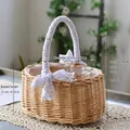 Handwoven wicker flower basket with white lace handles and bows in light natural wood finish - Oval Large Style