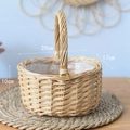 Detail of hand-woven wicker basket with dimensions 20cm by 17cm and plastic lining - Double Strip Oval Handheld Basket / Natural Wood Color