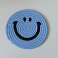 Light blue woven cotton coaster with a minimalist black smiley face pattern - 15cm Sky Blue Smiley