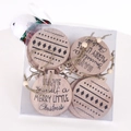 Set of round wooden Christmas ornaments with festive text in clear plastic packaging - Compass Round Style