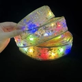 Ruban LED de Noël doré avec motifs d'étoiles et de notes colorés sur fond noir - 1m / Or Bronzant (Lumière Colorée)