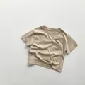 Close-up of kids' cotton t-shirt with round neck and square chest pocket detail - 80 / Khaki