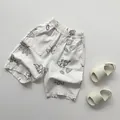 Dettaglio dei pantaloni in cotone lino per bambini con vita elastica e stampa botanica - 80cm / Color Farina d'Avena