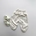Detail view of cream children's mosquito pants with elastic waist and soft cotton texture - Beige Apricot / 80cm