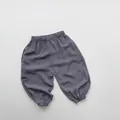 Detail of kids lightweight loose anti-mosquito pants with elastic waist and cuffed ankles - Dusty Blue / 80cm