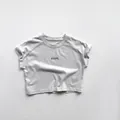 Detail view of cotton t-shirt featuring Hope text print and ribbed crew neckline - 80cm / Korean Gray