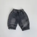 Detailed macro view of vintage washed grey kids denim shorts with elastic waistband - 80cm / Black
