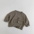 Detail of soft cotton kids long sleeve t-shirt with front flap pocket and roll cuffs - 80cm / Gray Wood Brown