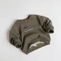 Détail de la doublure en polaire chaude et des poignets côtelés sur ce sweat enfant - 80cm / Thé de Pin