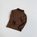 Close-up of brown ribbed knit sweater featuring contrasting black trim at the neck and cuffs - 80cm / Dark Coffee