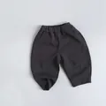 Detail of dark grey kids knitted joggers with elastic waist and side pockets - 80 / Charcoal Gray
