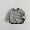 Detail of children's striped long sleeve tee with round neck and curved black hemline - 80cm / Black Stripe