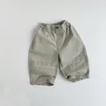 Détail du pantalon cargo enfant en coton vert kaki avec taille élastique et coutures - 80cm / Gris Argile