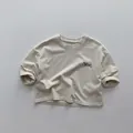 Dettaglio della maglietta beige in cotone per bambini con stampa a lettere MAROON - 80cm / Albicocca Calda