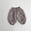 Detail view of toddler cargo pants showing breathable fabric texture and elastic waistband - Misty Pink / 80cm