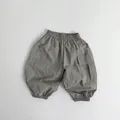 Detail view of elastic waistband and cargo pockets on light taupe toddler cargo pants - Grey Green / 80cm