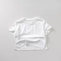 Close-up of white cotton kid's T-shirt featuring a round neck and side slit hem detail - 80cm / White