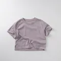 Detail of lavender cotton T-shirt featuring side slit hem and soft ribbed crew neck - 80cm / Gray