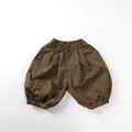 Détail du pantalon large en coton marron pour enfant avec taille élastique et poches - 80cm / café