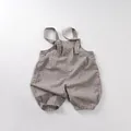 Detail of baby striped gray and white cotton jumpsuit with buttons and elastic leg cuffs - Khaki Plaid / 80cm