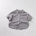 Flat lay of cotton linen short sleeve shirt for kids in smoke grey featuring chest pocket - 80cm / Grey Purple