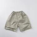 Detail view of khaki cotton casual shorts with comfortable elastic waist for kids - 80cm / Light Khaki
