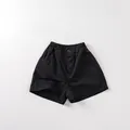 Detail of children's black cotton shorts featuring an elastic waist and side pockets - 80 / Black