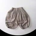 Detail view of cotton gauze toddler bloomer shorts with elastic waist and leg cuffs - Khaki / 80cm