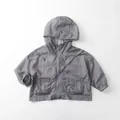 Detail view of lightweight grey kids sun protection hoodie with zipper and pockets - 80cm / Cloud Grey