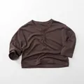 Detail view of children's dark coffee long-sleeve cotton shirt with a Henley neck and buttons - 80cm / Brown Coffee