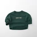 Close-up of a dark green long-sleeved cotton T-shirt with GOOD TIME text print - 80cm / Dark Green