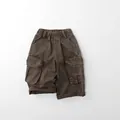 Close-up of kids cargo pants showing elastic waistband and large side utility pockets - 80cm / Brown