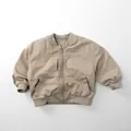 Detail of a beige kid's bomber jacket with ribbed collar and zipper closure style - 80cm / Khaki