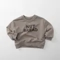 Detail of nut bread letter print and ribbed cuffs on kids brown cotton sweatshirt - 80cm / Grey Khaki