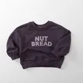 Detail of deep purple kids sweatshirt with NUT BREAD print and ribbed cuffs - 80cm / Grey Purple