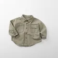 Detailed flat lay of an olive green cotton long sleeve shirt for kids with chest pockets - Khaki / 80cm
