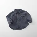 Detail of washed charcoal grey denim shirt for kids with double pockets and buttons - Fog Grey / 80cm