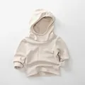 Detailopname van zachte beige fleece hoodie voor kinderen met premium stoftextuur - 80cm / Beige Abrikoos