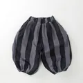 Detail view of children's fleece-lined striped balloon pants with elastic waistband - Dark Grey Stripes / 80cm