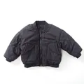 Detail view of black quilted kids jacket with ribbed cuffs and classic diamond patterns - 80cm / Fog Blue