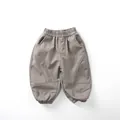 Detail of kids winter fleece-lined trousers with elastic waistband and cargo seam design - 80cm / Beige Grey