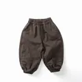 Detail view of children's thick dark brown harem pants with elastic waist and pocket seams - 80cm / Dark Brown