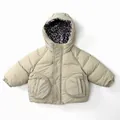 Detail of beige kids padded jacket with leopard print hood lining and round pockets - Beige Apricot / 80cm