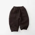 Detail of dark brown children fleece joggers featuring elastic waist and large side pockets - Dark Coffee / 80cm