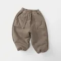 Detail of dark brown thermal kids joggers featuring elastic waist and large patch pockets - Khaki / 80cm
