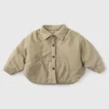 Close-up of khaki padded cotton shirt with corduroy texture and button pockets for kids - Khaki / 80cm