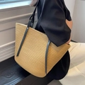 Detail view of woven straw tote bag with black leather straps and white contrast stitching - 45*28 / Khaki With Leather Belt