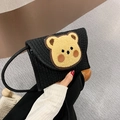 Black woven envelope crossbody bag featuring a cute yellow bear patch for summer beach style - Black