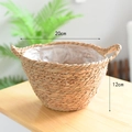 Detail of woven seagrass plant basket with dual handles and internal plastic liner - 20*12