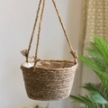 Handwoven straw hanging planter with plastic liner and natural jute rope for indoor plants - 20cm Diameter